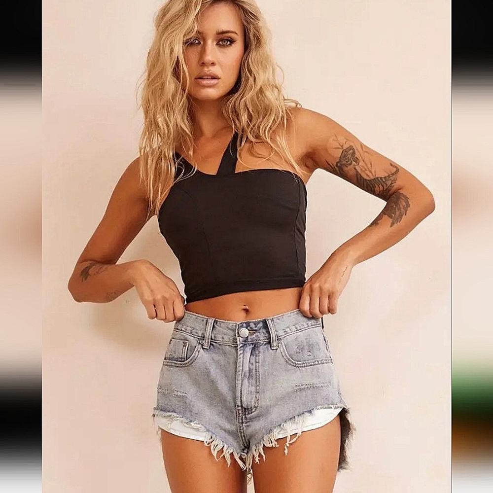 NWT distressed mid-rise denim shorts, size medium.